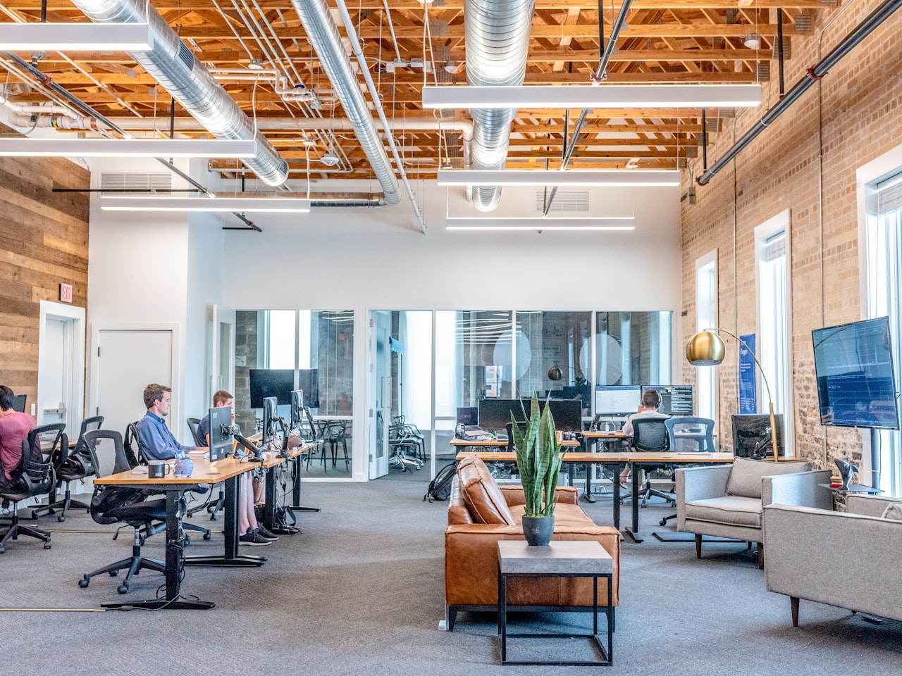 Modern tech office with monitors and team collaboration